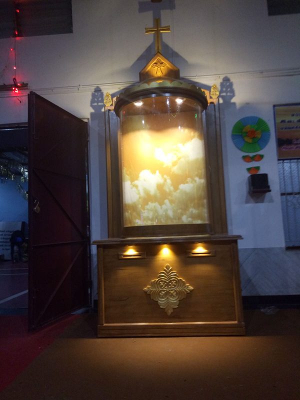 Backlit wooden altar unit with display niches crafted in Coimbatore