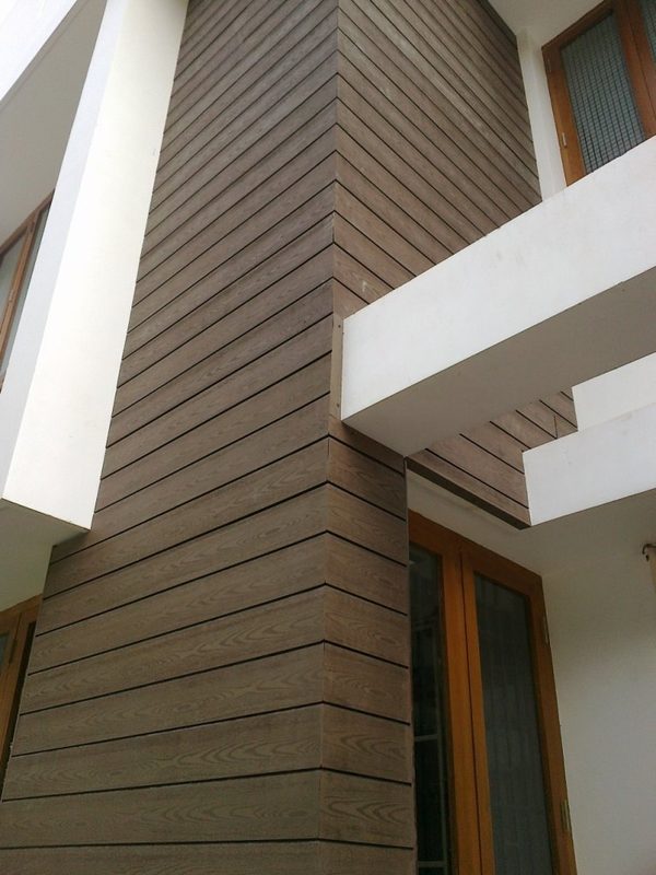 Outdoor WPC wall cladding wrapping a building column in Coimbatore