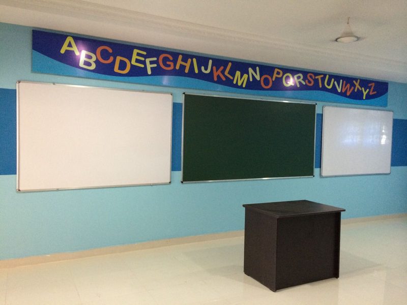 Primary classroom fit-out with boards and student furniture in Coimbatore
