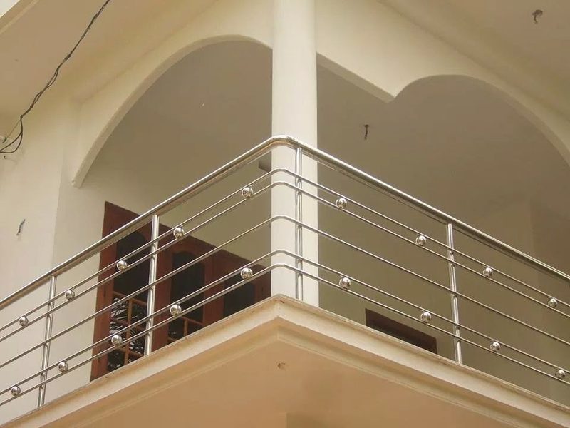 Stainless steel balcony railing with horizontal bars in a Coimbatore home