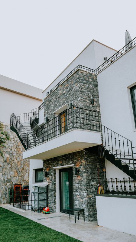Decorative stone wall cladding on elevation of modern home in Coimbatore